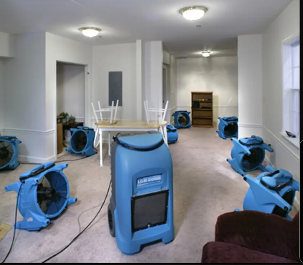 Air movers and dehumidifier setup for Water Damage Restoration in Willard