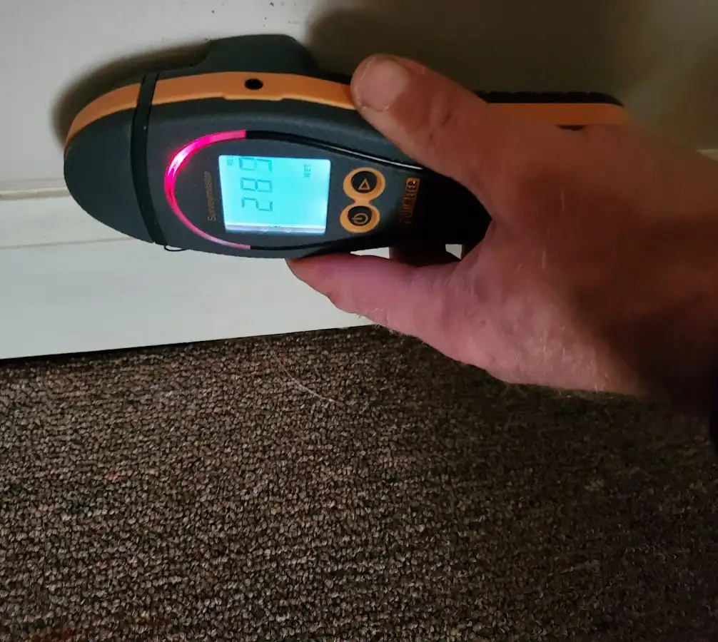 Moisture detection at baseboard during Storm Damage Restoration in Willard